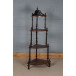 Edwardian mahogany and boxwood strung four tier corner what-not, with turned finials and supports,