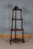 Edwardian mahogany and boxwood strung four tier corner what-not, with turned finials and supports,