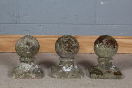 Three gate post finials, in the form of an orb on a plinth, 27cm high
