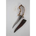 19th Century Indian bichwa dagger, the pierced brass handle above a swept blade and fabric mounted