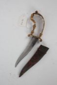 19th Century Indian bichwa dagger, the pierced brass handle above a swept blade and fabric mounted