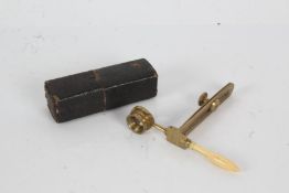 19th Century pocket field microscope, with folding lens and handle, housed in a slip case, 8.5cm