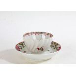 19th Century porcelain tea bowl, painted with pink and blue flowers, together with a similar 19th