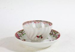 19th Century porcelain tea bowl, painted with pink and blue flowers, together with a similar 19th