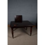 Victorian mahogany extending dining table, with chamfered corners and raised on ring turned legs and