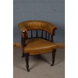 Victorian tan leatherette desk chair, the curved button back above spindle turned supports and