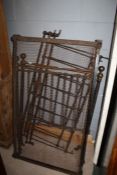 Victorian cast iron childs bed/ cot, with brass finials, 76cm wide