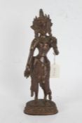 Indian bronze deity, modelled with left hand raised, 30cm high