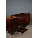 Early 20th century mahogany sideboard, having serpentine central section and fitted four drawers