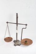 Pair of cast iron balance scales, with copper pans and small set of six brass weights