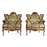 Pair of late 19th Century walnut armchairs, the shaped top rail with a carved shell above channel