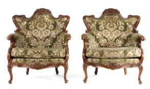 Pair of late 19th Century walnut armchairs, the shaped top rail with a carved shell above channel