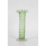 20th century green glass vase, with a frilled neck and a cylindrical body raised on shell feet, 26cm