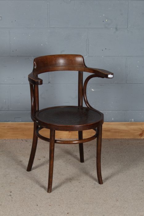 A.P.M. Polish bentwood elbow chair, with curved cresting rail and shell decorated seat, raised on