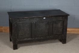 18th Century and later oak coffer, the hinged lid above foliate carved frieze and triple foliate