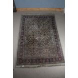 Large middle eastern rug, the blue and cream ground, with a floral repeating pattern to the center