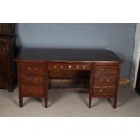 20th century oak desk, with seven draws with swan neck handles, 76cm high 150cm wide
