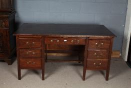 20th century oak desk, with seven draws with swan neck handles, 76cm high 150cm wide