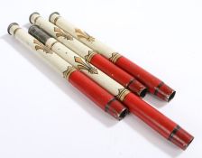 Set of four painted candle holders, in red, cream and gold, 29.5cm long