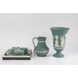 Wedgwood sage green jasperware, to include jug with white shell decoration, vase, three pots and