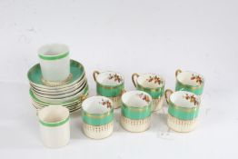 Six Aynsley coffee cans with five matching saucers, all with fruit decoration, and two white and