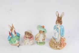 Three Royal Albert Beatrix Potter figurines, one large example, and one unmarked (4)