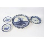 Two Delft blue and white chargers, 39cm diameter, two Delft plates, 19.5cm diameter, all decorated