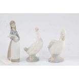Lladro figure modelled as a young lady holding a piglet, 17cm high, two Nao ducks, 15cm and 14.5cm