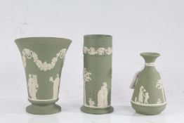Three Wedgwood green jasperware vases, all with classical figural decoration, to include a