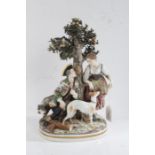 Capodimonte porcelain figural group depicting a huntsman seated beneath a tree in discussion with