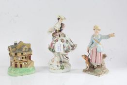 Staffordshire porcelain money box in the form of a house, 13.5cm high, two porcelain figures