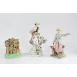 Staffordshire porcelain money box in the form of a house, 13.5cm high, two porcelain figures