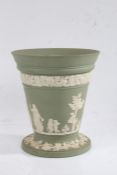 Wedgwood green jasperware flower vase, the tapering body with foliate band above classical figural