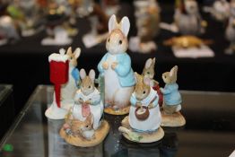 Five boxed Beatrix Potter Peter Rabbit figures, to include Peter Rabbit Posting a Letter and others,