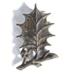 A 15th century pewter secular badge, the badge depicting a holly sprig 42mm long  This badge