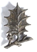 A 15th century pewter secular badge, the badge depicting a holly sprig 42mm long  This badge