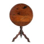 A William & Mary oak tripod table, circa 1700, the circular top with ovolo-moulded edge, tilting on