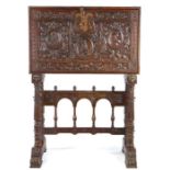 A 16th century style walnut Vargueno, 18th/19th century, the rectangular top above a carved hinged