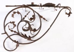 An early 18th century decorative wrought iron candle wall bracket, with scrolling and acanthus leaf