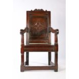 A Charles I joined oak panel-back open armchair, West Country, circa 1640 The back panel centred by