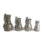 A group of four 18th century pewter Jersey lidded measures, circa 1790-1830 To include a pint