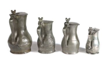 A group of four 18th century pewter Jersey lidded measures, circa 1790-1830 To include a pint