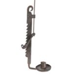 A 19th century iron adjustable height candleholder, the ratcheted stem with folded candle socket