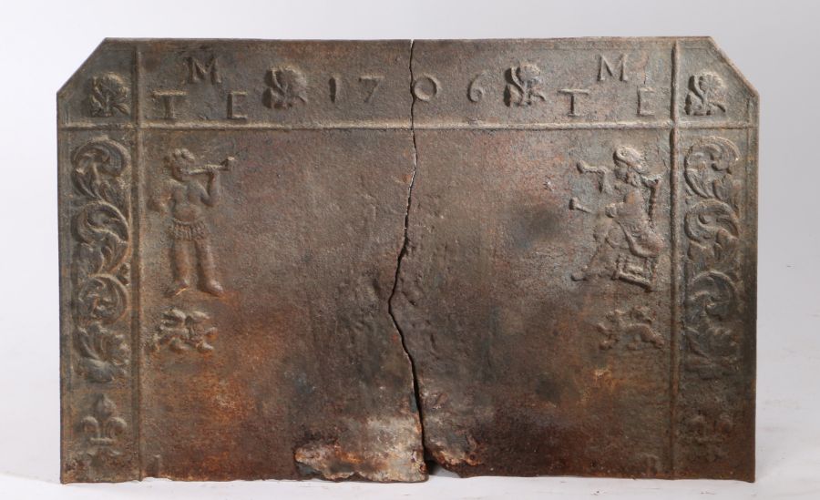 A early 18th century cast iron fire back, of rectangular form with canted corners, headed by the - Image 2 of 2