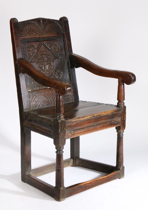 A Charles I oak panel-back open armchair, West Country, circa 1630, the pediment top rail lunette- - Image 3 of 3