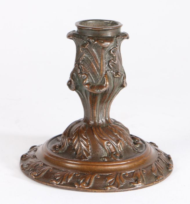 A mid-18th century bronze ‘lantern’ candlestick In the English Rococo manner, finely foliate cast,