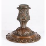 A mid-18th century bronze ‘lantern’ candlestick In the English Rococo manner, finely foliate cast,