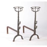 A pair of 18th century iron cresset topped fire dogs, the stem with spit hooks, 60cm high, 46cm