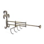 An 18th century iron and brass adjustable fireside cooking hook/spit, the fleur de lys style hook