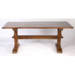 An 18th century trestle-end long table, English Having an end-cleated twin plank top, on